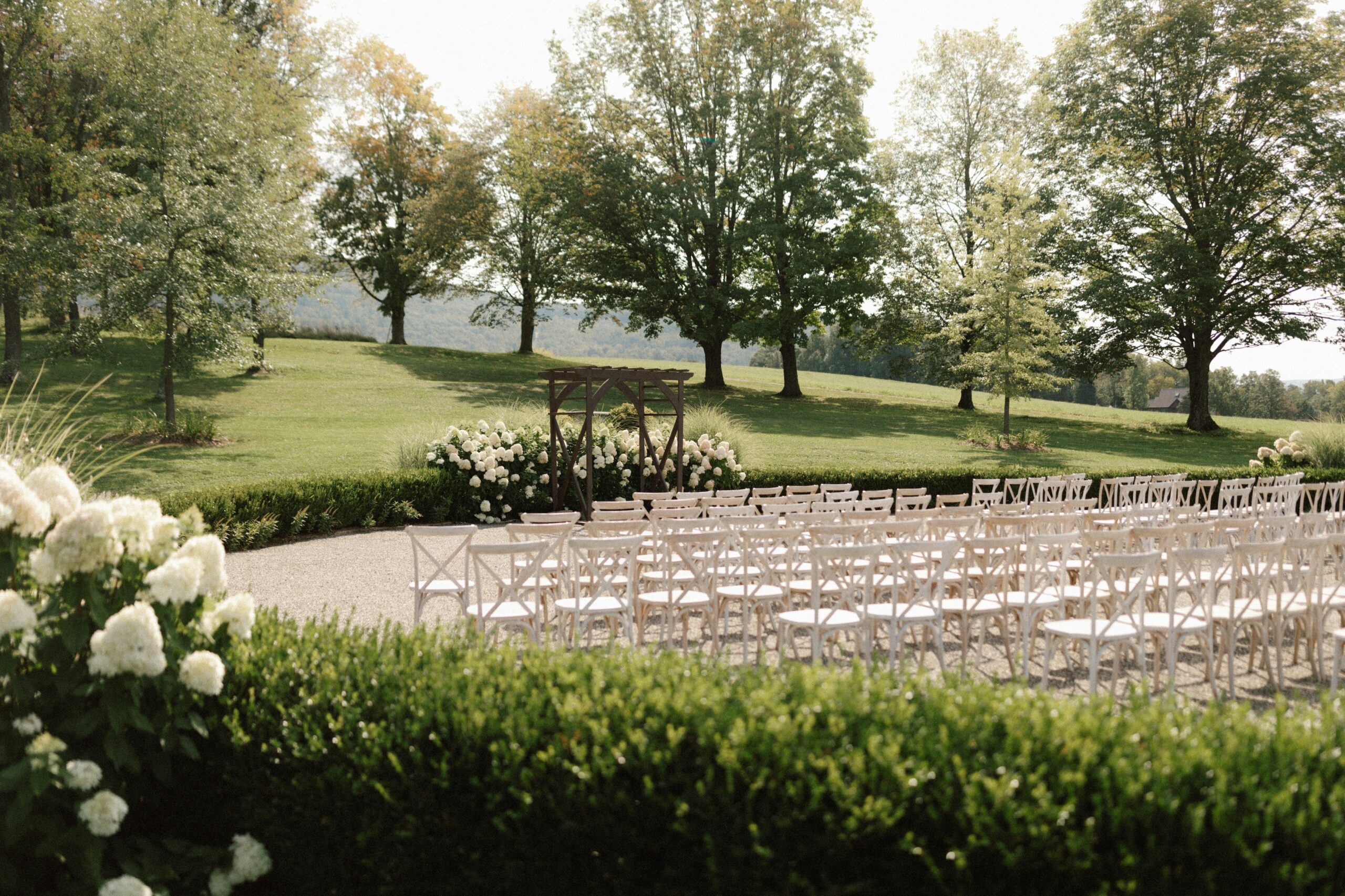 An outdoor wedding ceremony under trees