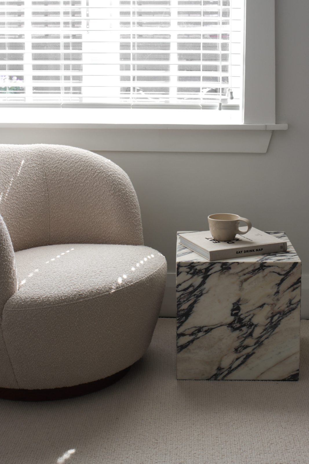 Cozy armchair and side table by a bright window