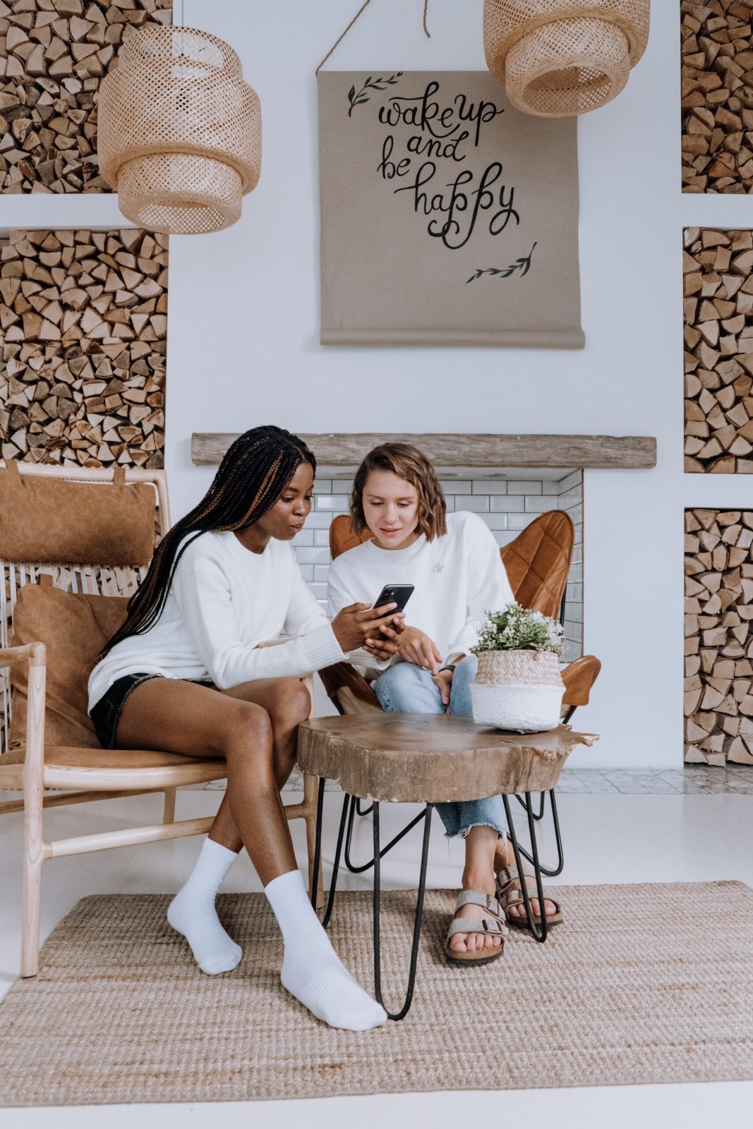 Two women chatting in a styled lounge