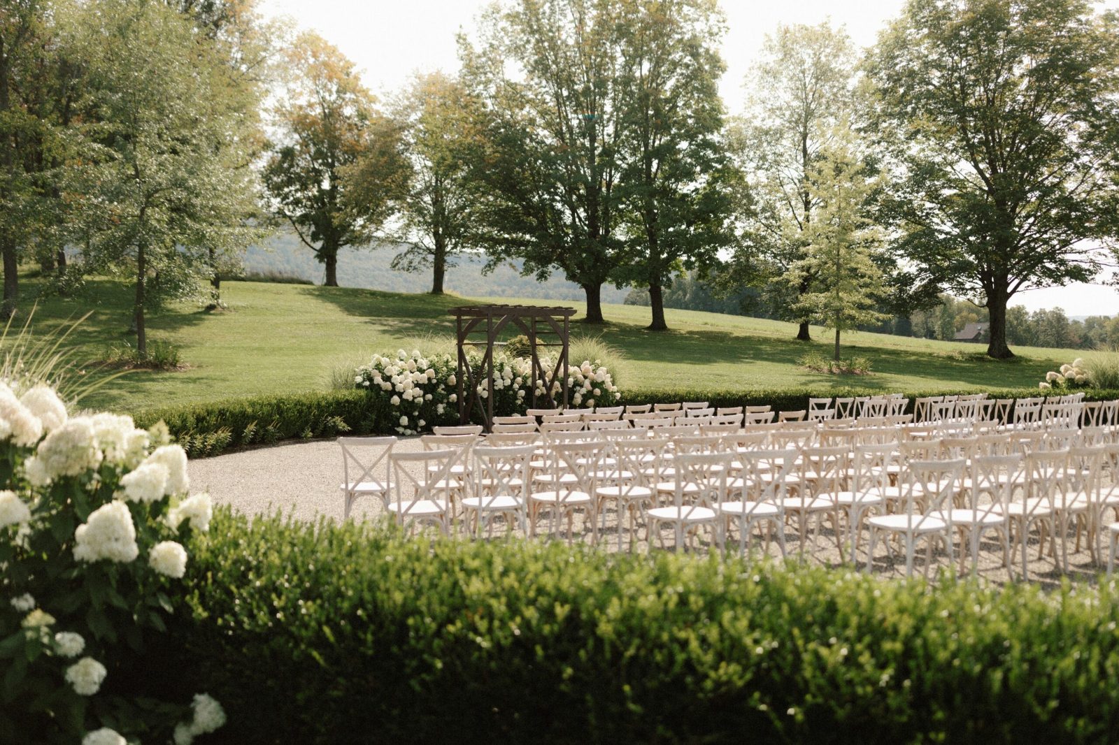 An outdoor wedding ceremony under trees
